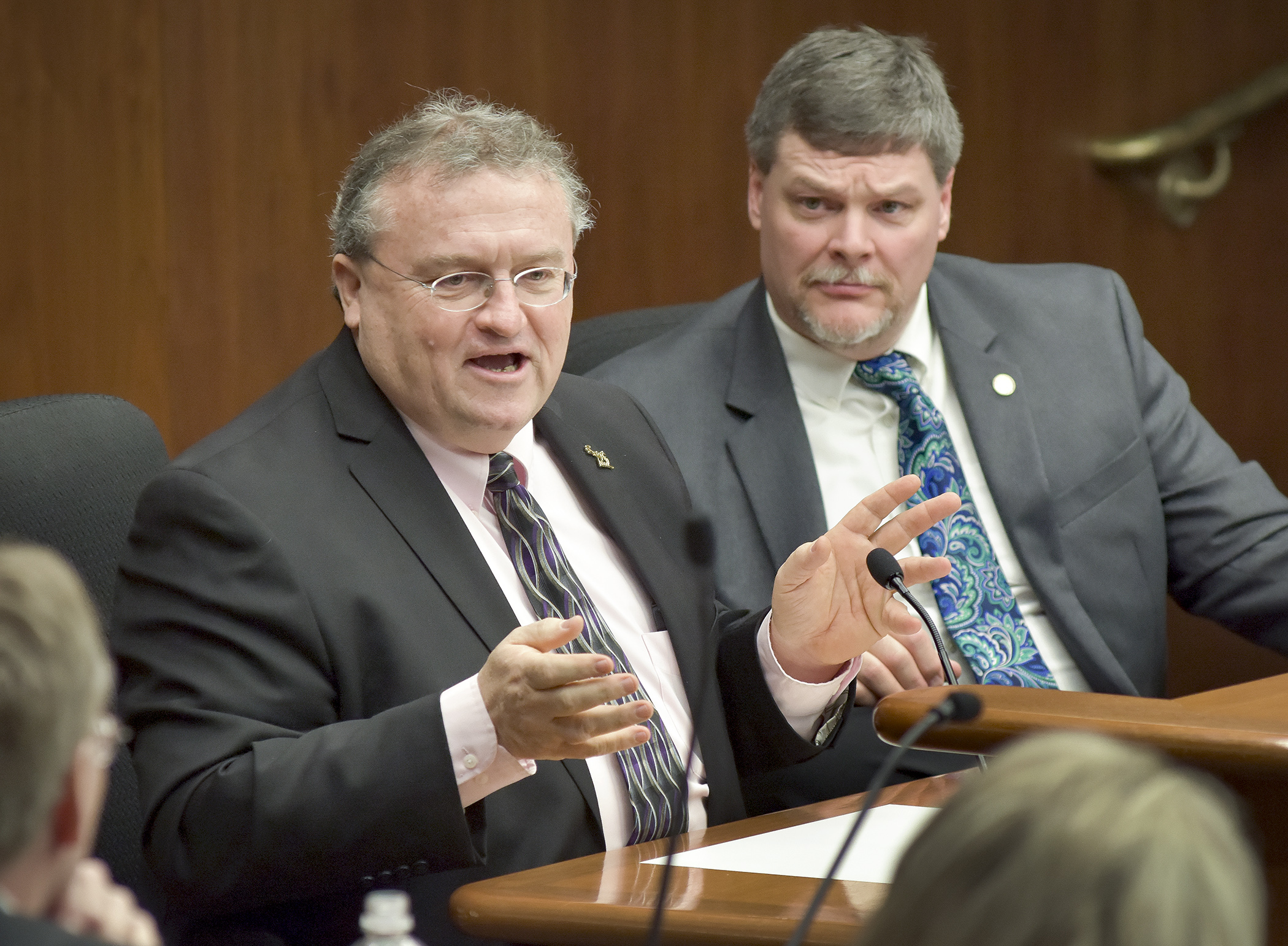 Tom Barrett, executive director of the Gambling Control Board, testifies before the House Government Operations and Elections Policy Committee Jan. 19 during discussion of a bill sponsored by Rep. Jim Newberger, right, that would establish a candidate campaign raffle. Photo by Andrew VonBank